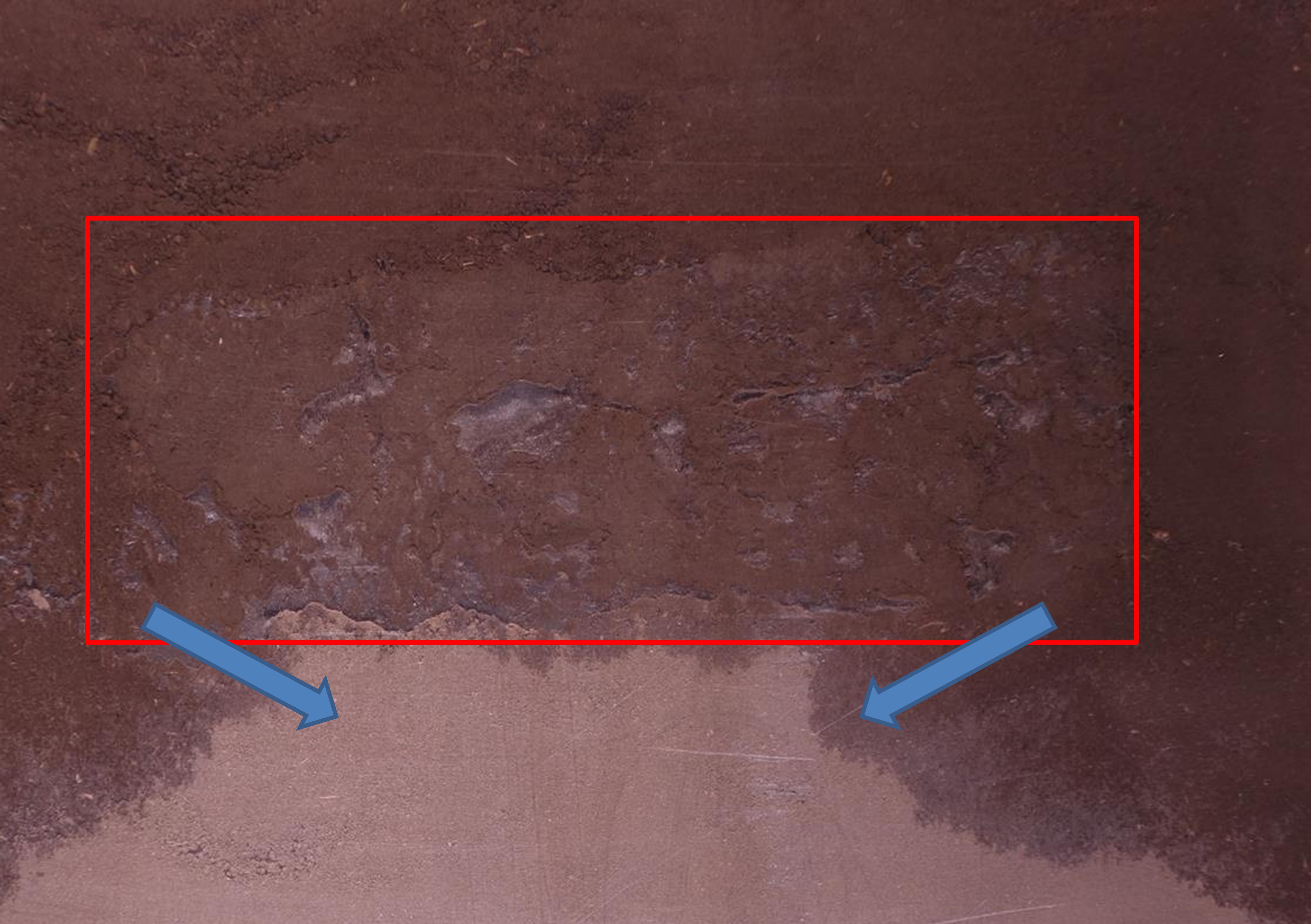 Water, as it drains through the soil profile, is limited by a zone of highly compacted soil (outlined by the red box).