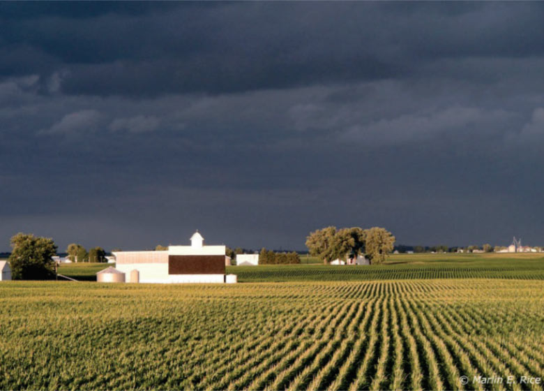 Photo - 
 Farm scene with storm clouds in background
