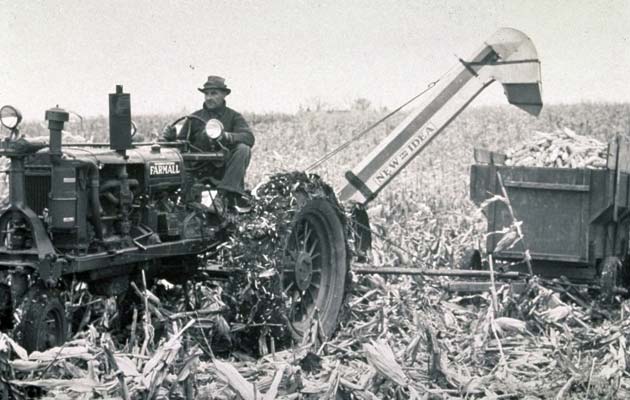 Corn harvest with a tractor-drawn corn picker.