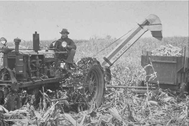 Harvesting corn with a tractor-pulled corn picker in the 1930s
